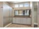 Modern bathroom with a double sink vanity, glass shower, and bright natural light at 3336 Goodyear St, Castle Rock, CO 80109