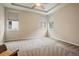 Spacious bedroom with plush carpet, ceiling fan and large window allowing ample light at 3336 Goodyear St, Castle Rock, CO 80109