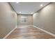 Neutral bedroom features recessed lighting, wood floor, and window allowing natural light at 3336 Goodyear St, Castle Rock, CO 80109