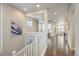 Spacious second floor hallway featuring hardwood floors with a view of the living areas at 3336 Goodyear St, Castle Rock, CO 80109