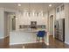 Bright kitchen with white cabinetry, granite countertops, and stainless steel appliances at 3336 Goodyear St, Castle Rock, CO 80109