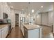 Modern kitchen island with granite counters, stainless appliances, and ample storage space at 3336 Goodyear St, Castle Rock, CO 80109