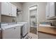 Functional laundry room with modern washer, dryer, and closet space, optimizing convenience and storage at 3336 Goodyear St, Castle Rock, CO 80109