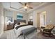 Beautifully decorated main bedroom offers comfortable seating, lots of light and modern decor at 3336 Goodyear St, Castle Rock, CO 80109