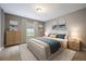 Serene main bedroom featuring plush carpeting, stylish decor, and soft natural light for a relaxing atmosphere at 3336 Goodyear St, Castle Rock, CO 80109