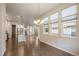 Open floorplan living space with hardwood floors, lots of natural light and modern fixtures at 3336 Goodyear St, Castle Rock, CO 80109