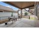 Covered patio features two cushioned chairs with iron railing and views of the complex at 3336 Goodyear St, Castle Rock, CO 80109