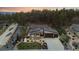 Expansive aerial view of the home showcasing its modern design, three-car garage, landscaped yard, and picturesque surroundings at 16244 Thunder Cat Way, Monument, CO 80132