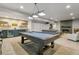 Basement includes a large entertaining space, bar and pool table along with a media room and fireplace at 16244 Thunder Cat Way, Monument, CO 80132