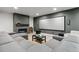 Basement with a modern fireplace, entertainment area, and projector screen at 16244 Thunder Cat Way, Monument, CO 80132
