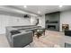 Finished basement with large sectional couch, fireplace, and home theater projector at 16244 Thunder Cat Way, Monument, CO 80132