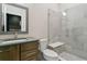 Contemporary bathroom featuring a glass-enclosed shower with a built-in seat, and a stylish vanity at 16244 Thunder Cat Way, Monument, CO 80132