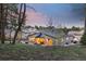 Exterior view showcasing a backyard patio surrounded by trees, offering a serene and private outdoor living space at 16244 Thunder Cat Way, Monument, CO 80132