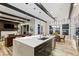 The kitchen area opens up to the living room and dining area, perfect for entertaining guests and Gathering at 16244 Thunder Cat Way, Monument, CO 80132
