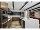 Modern kitchen with sleek cabinets, stainless steel appliances, and a large center island at 16244 Thunder Cat Way, Monument, CO 80132
