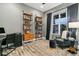 Bright office space with custom shelves, a comfortable chair, and ample workspace at 16244 Thunder Cat Way, Monument, CO 80132