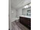 Bright bathroom with modern vanity, sleek fixtures, and ample counter space at 9220 Wilde Ln # 102, Parker, CO 80134