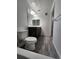Bathroom features hardwood floors, a cozy fireplace, and plenty of natural light at 9220 Wilde Ln # 102, Parker, CO 80134