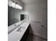 Bright bathroom with modern vanity, sleek fixtures, and ample counter space at 9220 Wilde Ln # 102, Parker, CO 80134
