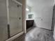 Spacious bathroom features updated vanity, glass shower enclosure, and contemporary design at 9220 Wilde Ln # 102, Parker, CO 80134
