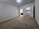 Spacious carpeted bedroom with two doors, including one leading to the bathroom at 9220 Wilde Ln # 102, Parker, CO 80134