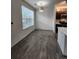 Dining room with window providing lots of natural light, and gray wood-look flooring at 9220 Wilde Ln # 102, Parker, CO 80134