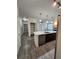 Open concept living area with large island and access to other rooms at 9220 Wilde Ln # 102, Parker, CO 80134