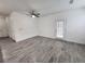 Bright, open living area with gray floors and a door for lots of natural light at 9220 Wilde Ln # 102, Parker, CO 80134