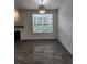 Cozy living room with large window and wood-look flooring, providing lots of natural light at 9220 Wilde Ln # 102, Parker, CO 80134