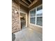 Cozy patio area with stone accents, perfect for outdoor relaxing and entertaining guests at 9220 Wilde Ln # 102, Parker, CO 80134