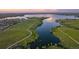 Aerial view of lake and walking paths at sunset at 3929 S Quemoy Ct, Aurora, CO 80018