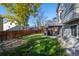 Large backyard with patio, deck, and mature trees at 3929 S Quemoy Ct, Aurora, CO 80018