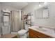 Clean basement bathroom with shower, toilet and vanity at 3929 S Quemoy Ct, Aurora, CO 80018