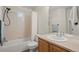 Clean bathroom with tub, shower, and vanity at 3929 S Quemoy Ct, Aurora, CO 80018