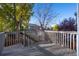 Deck overlooking the backyard with a view of the neighborhood at 3929 S Quemoy Ct, Aurora, CO 80018