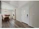 Bright entryway with hardwood floors, chandelier, and formal dining area at 3929 S Quemoy Ct, Aurora, CO 80018