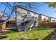 Two-story house exterior with deck and fenced yard at 3929 S Quemoy Ct, Aurora, CO 80018