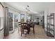 Eat-in kitchen with light gray cabinets, stainless steel appliances, and tile flooring at 3929 S Quemoy Ct, Aurora, CO 80018