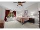 Main bedroom with king-size bed, large window, and ceiling fan at 3929 S Quemoy Ct, Aurora, CO 80018