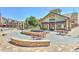 Outdoor patio seating area with tables and a fountain at 3929 S Quemoy Ct, Aurora, CO 80018