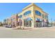 Retail building exterior with multiple shops and parking at 3929 S Quemoy Ct, Aurora, CO 80018