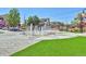 Scenic town square with water features, landscaping, and shops at 3929 S Quemoy Ct, Aurora, CO 80018