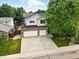 Aerial view of the house showcasing its large driveway and curb appeal at 2078 Goldfinch Ct, Longmont, CO 80503