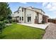 Exterior of home with backyard featuring a well-kept lawn at 2078 Goldfinch Ct, Longmont, CO 80503