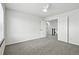 Bedroom featuring carpet, neutral walls, and a view into adjoining hallway at 2078 Goldfinch Ct, Longmont, CO 80503