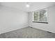 Bright bedroom features a window and neutral carpet at 2078 Goldfinch Ct, Longmont, CO 80503