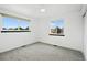 Bedroom with two windows letting in plenty of natural light at 2078 Goldfinch Ct, Longmont, CO 80503