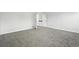 Bedroom with neutral-toned walls, carpet, and view to adjoining room at 2078 Goldfinch Ct, Longmont, CO 80503