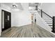 Inviting foyer showcases high ceilings, a modern staircase, and wood-style flooring at 2078 Goldfinch Ct, Longmont, CO 80503