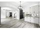 Spacious open-concept kitchen featuring modern fixtures and finishes next to the entryway at 2078 Goldfinch Ct, Longmont, CO 80503
